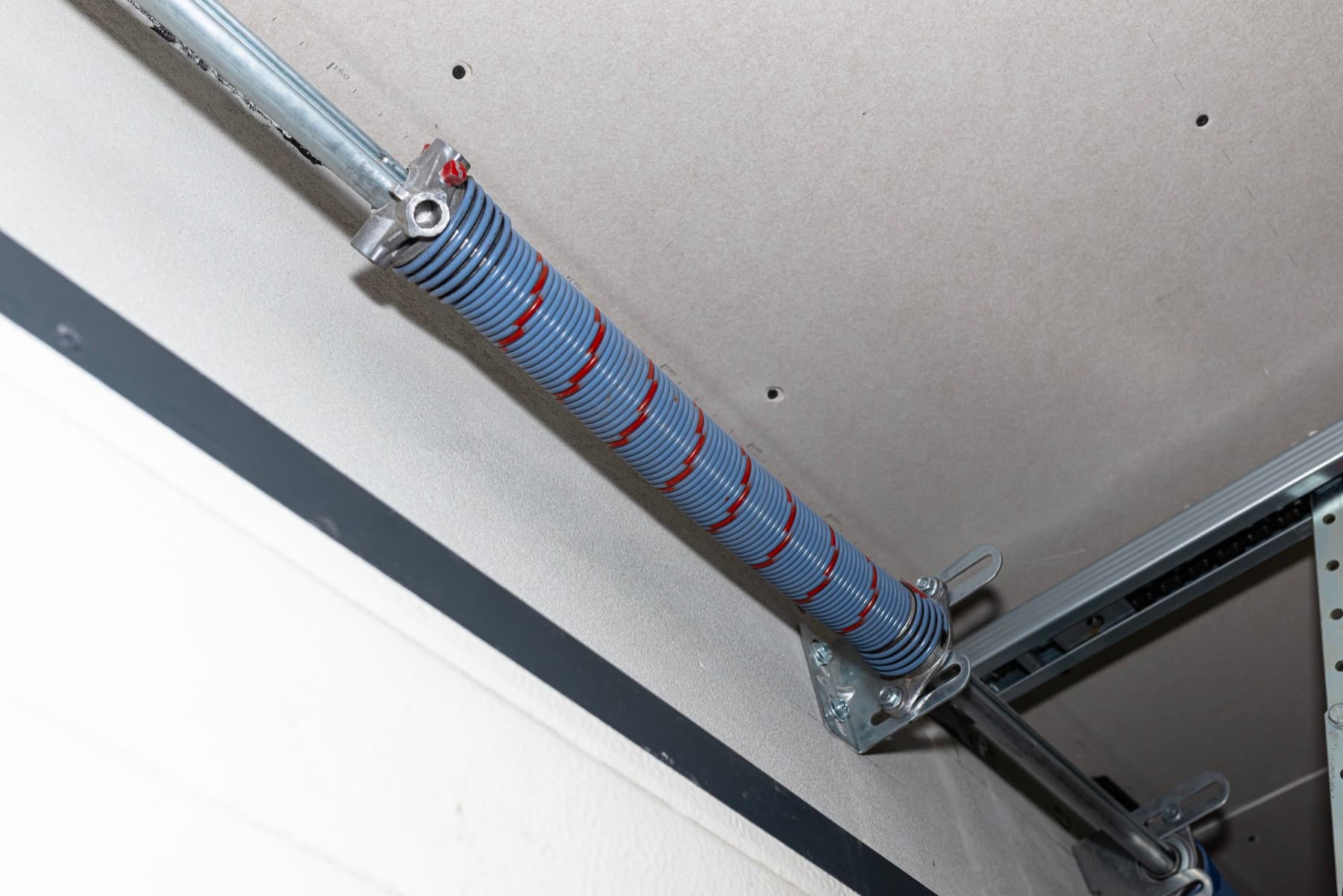 Torsion spring on a shaft above a garage door